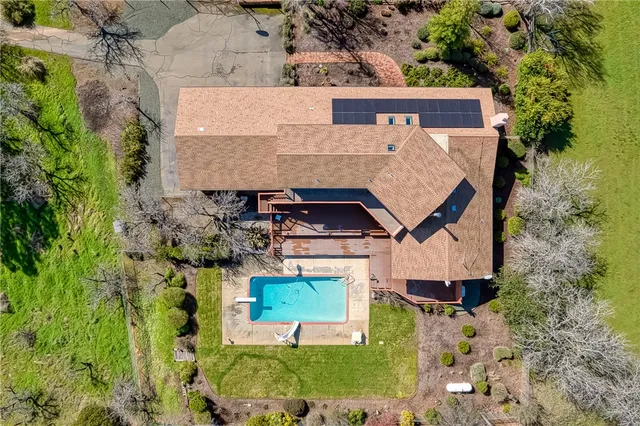 a kitchen with granite countertop a refrigerator and cabinets