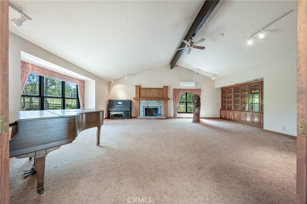 6535 Highland Springs Road Lakeport, CA 95453 - Photo 38 of 75 a view of an empty room with a fireplace and a window