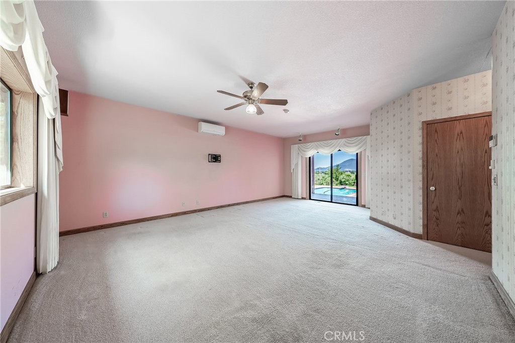 6535 Highland Springs Road Lakeport, CA 95453 - Photo 58 of 75 a view of a livingroom with a ceiling fan and window