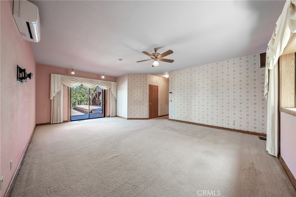 6535 Highland Springs Road Lakeport, CA 95453 - Photo 60 of 75 a view of a livingroom with a ceiling fan and window