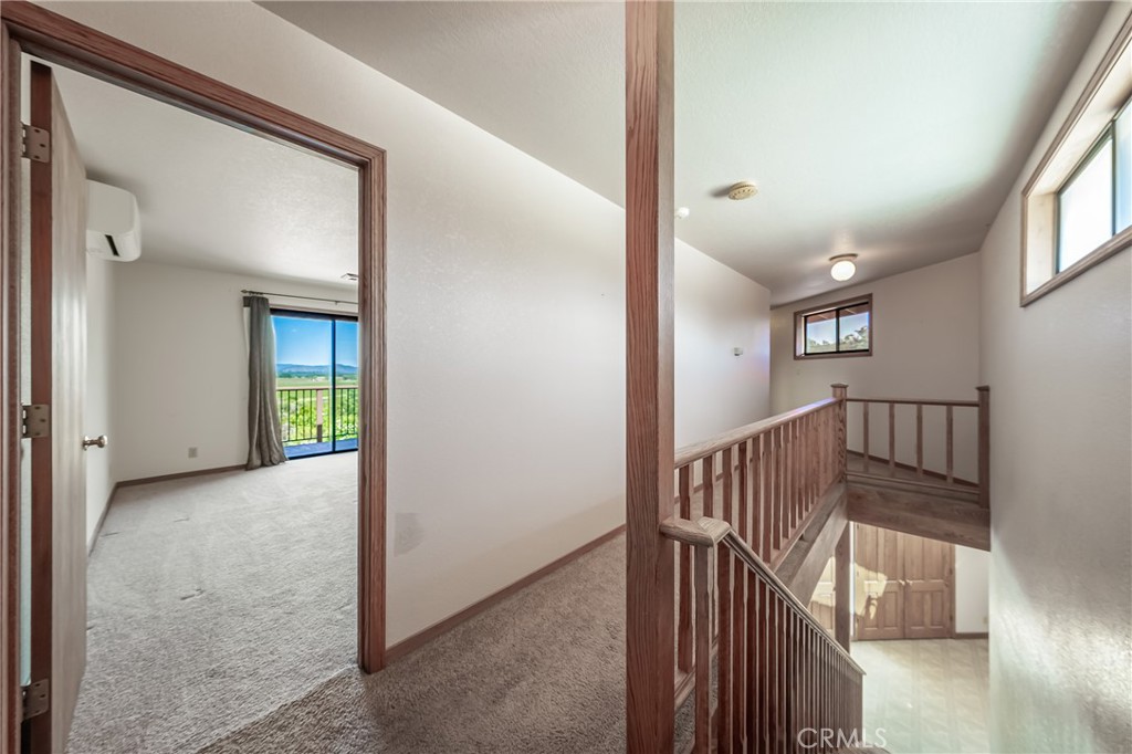 6535 Highland Springs Road Lakeport, CA 95453 - Photo 67 of 75 a view of hallway with stairs and wooden floor
