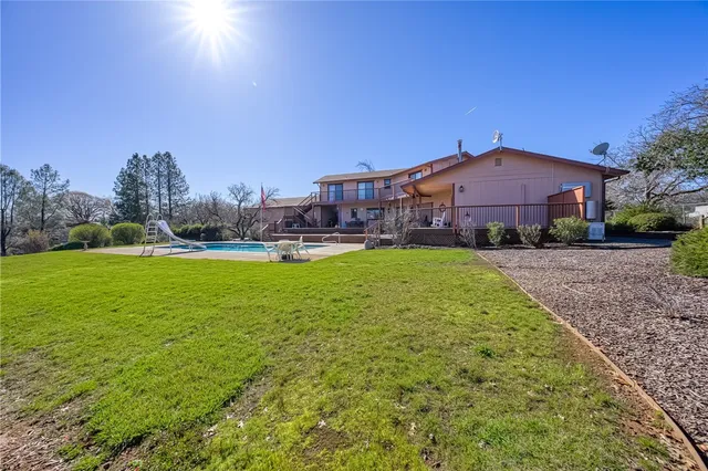 a view of swimming pool with chairs