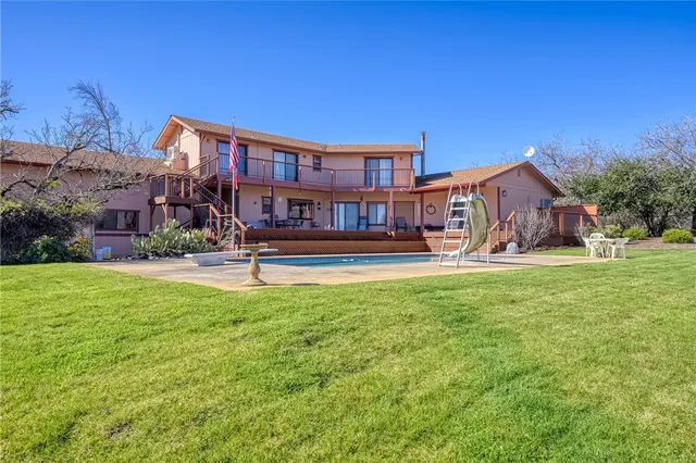 a view of a swimming pool with a lounge chair