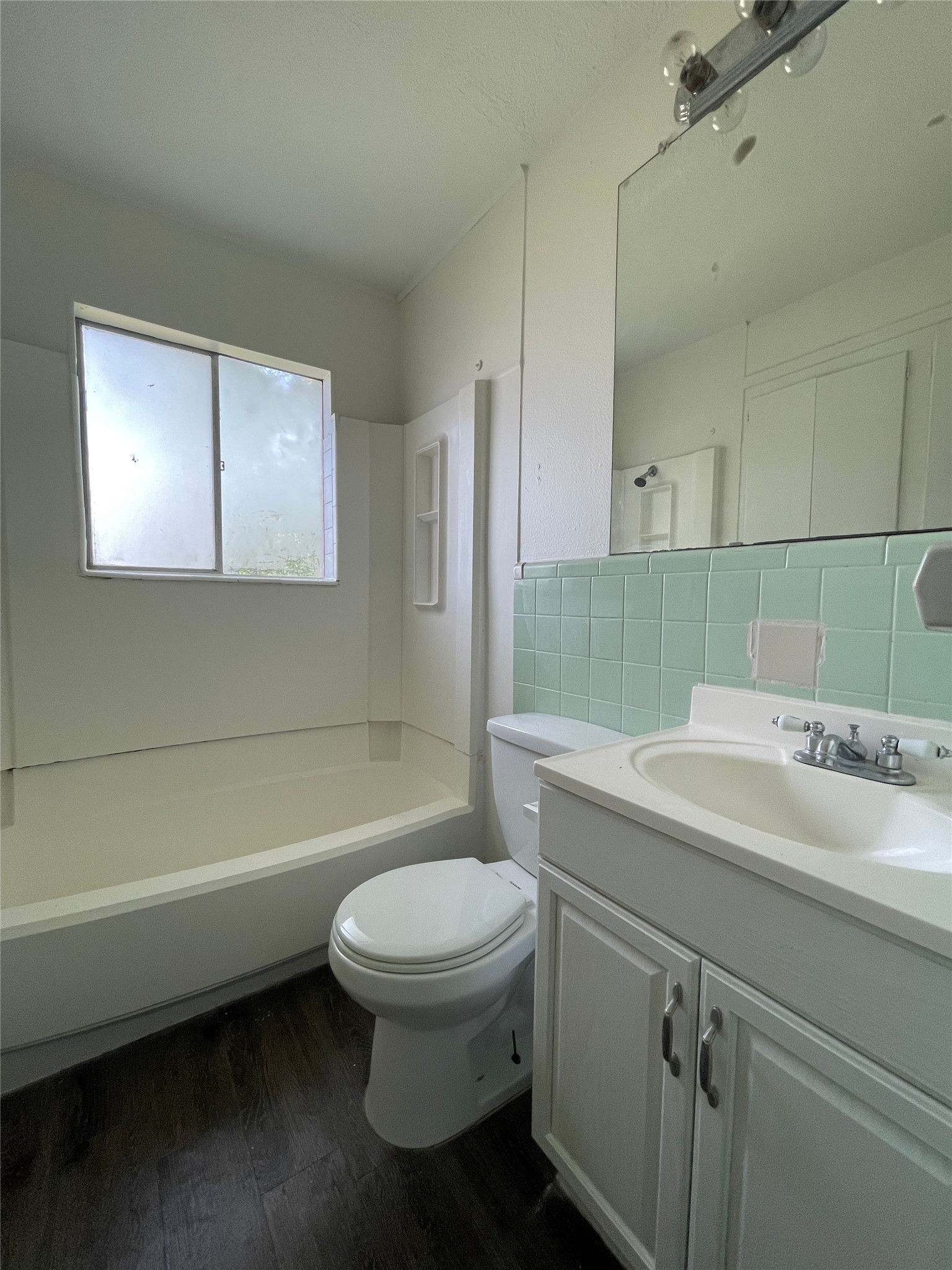 3106 Duval Street, Unit 303 Austin, TX 78705 - Photo 9 of 13 a bathroom with a sink toilet and shower