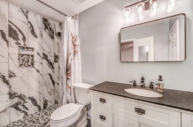 a bedroom with furniture and a bed