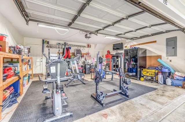 a view of swimming pool with outdoor seating and plants