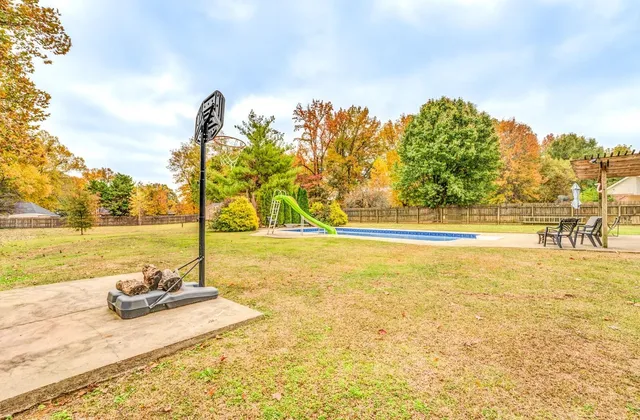 a view of yard and swimming pool