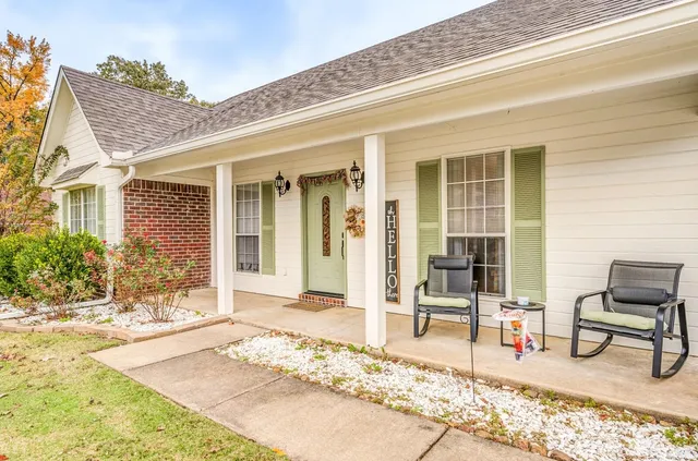 a view of a lounge chair in the front of a house