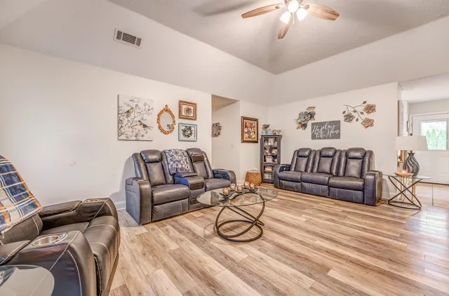 a view of a livingroom with furniture and wooden floor