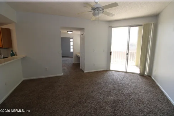 a bedroom with a bed and a potted plant