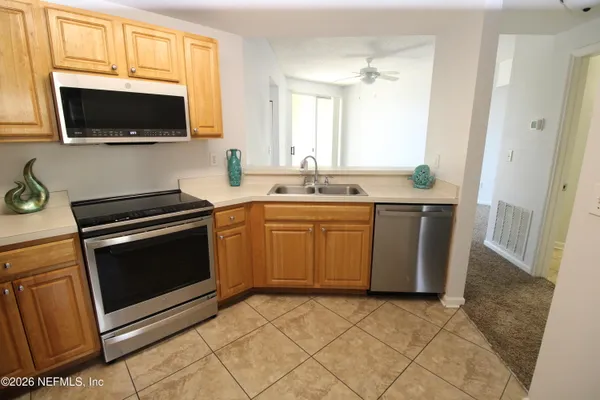 a bedroom with bed and a painting