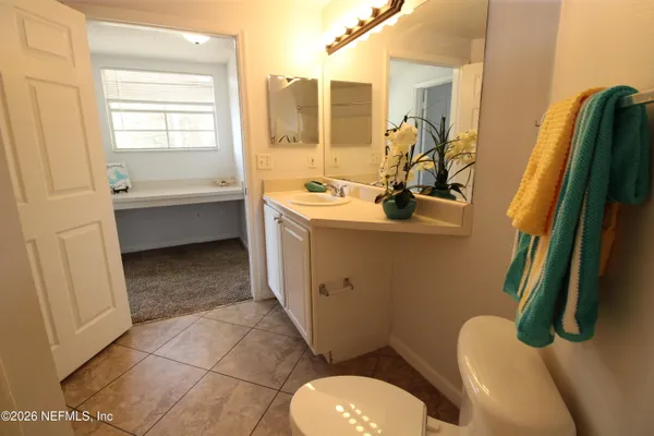 a view of a swimming pool with outdoor seating