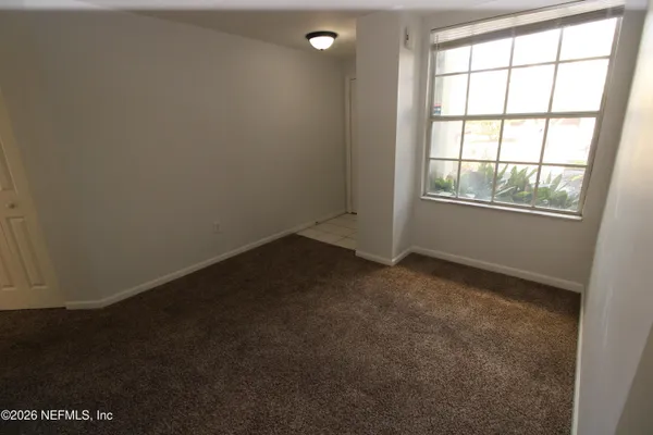 a kitchen with stainless steel appliances a stove a sink and a microwave