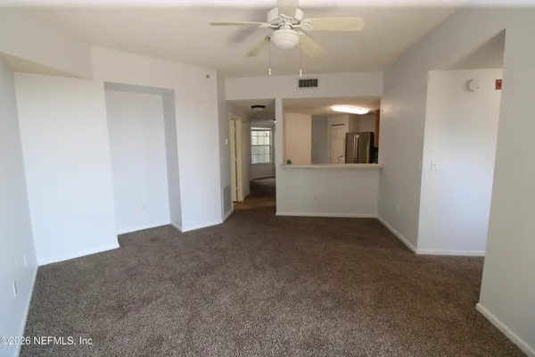 a kitchen with stainless steel appliances a refrigerator stove and microwave