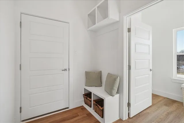 a view of walk in closet with empty racks