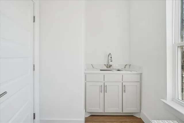 a view of a hallway with a window