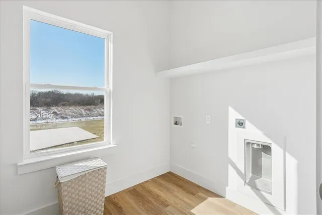 a living room with furniture fireplace and window