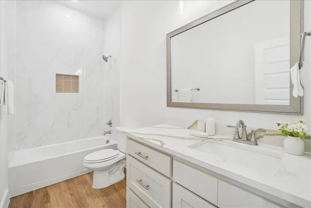 a spacious bedroom with a bed and a couch