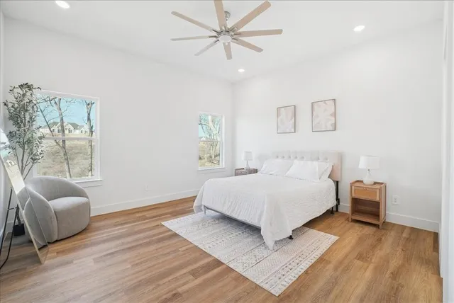 a bathroom with double vanity sinks and a mirror