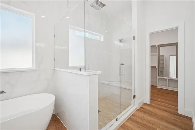 a white bath tub sitting in a bathroom