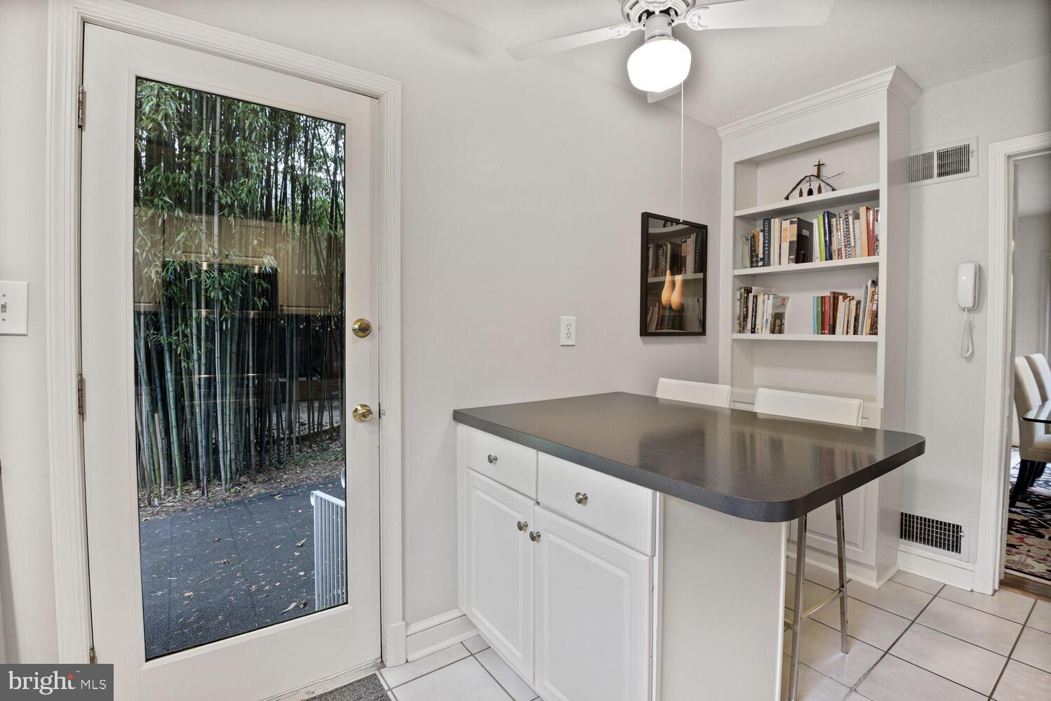7721 Maryknoll Avenue Bethesda, MD 20817 - Photo 11 of 33 a kitchen with a table and chairs