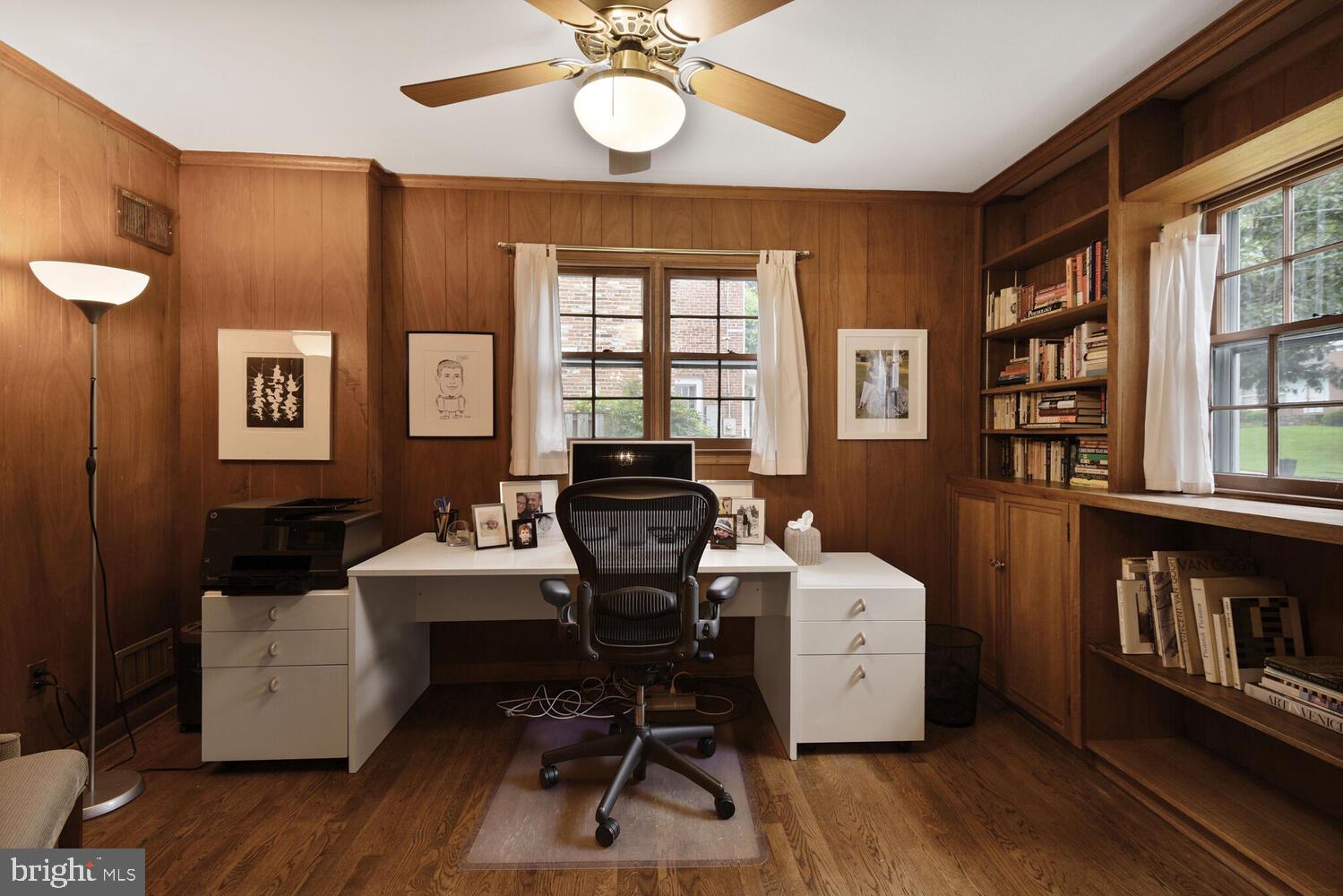 7721 Maryknoll Avenue Bethesda, MD 20817 - Photo 13 of 33 a view of a workspace with furniture and a window