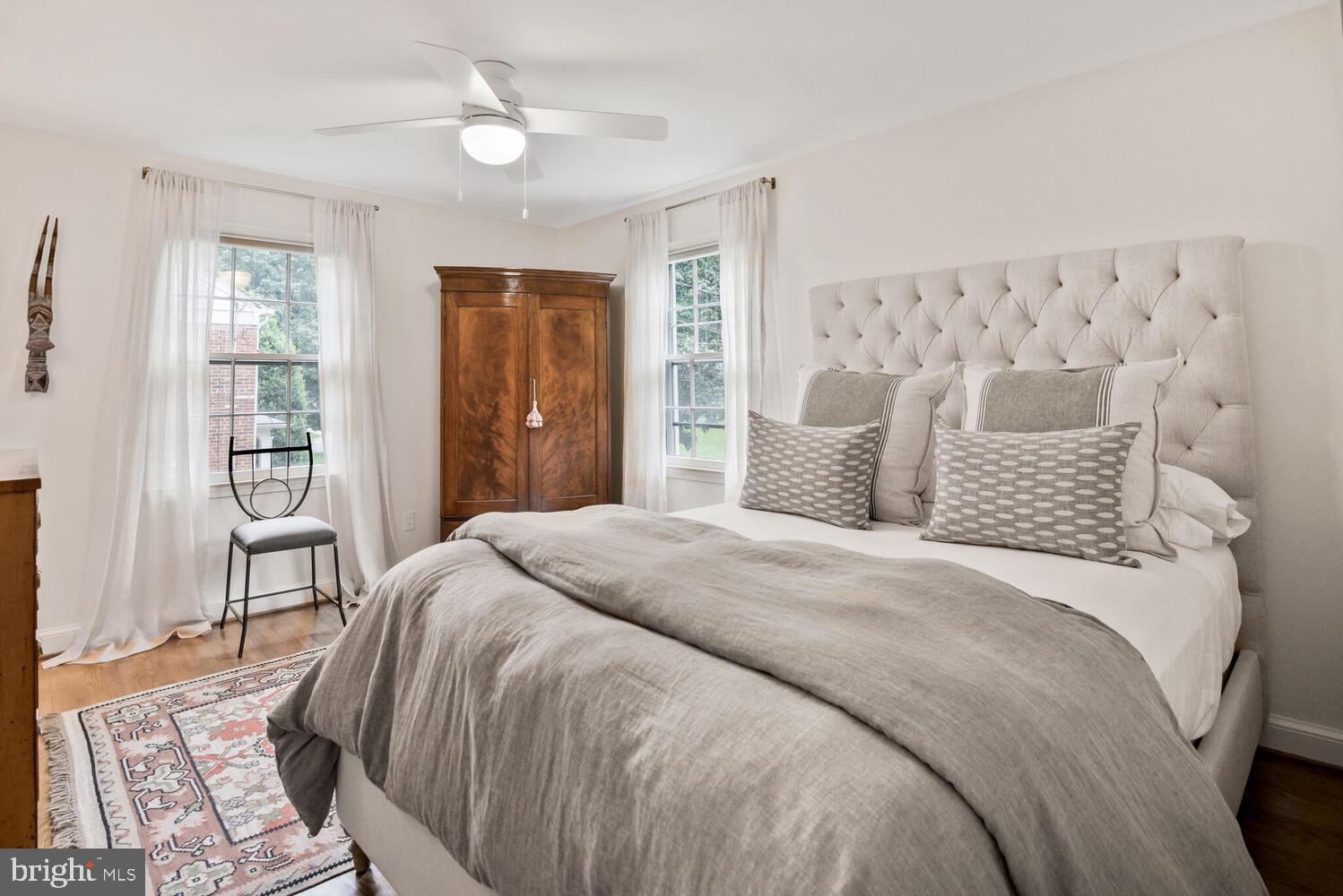 7721 Maryknoll Avenue Bethesda, MD 20817 - Photo 19 of 33 a bedroom with a large bed and a window