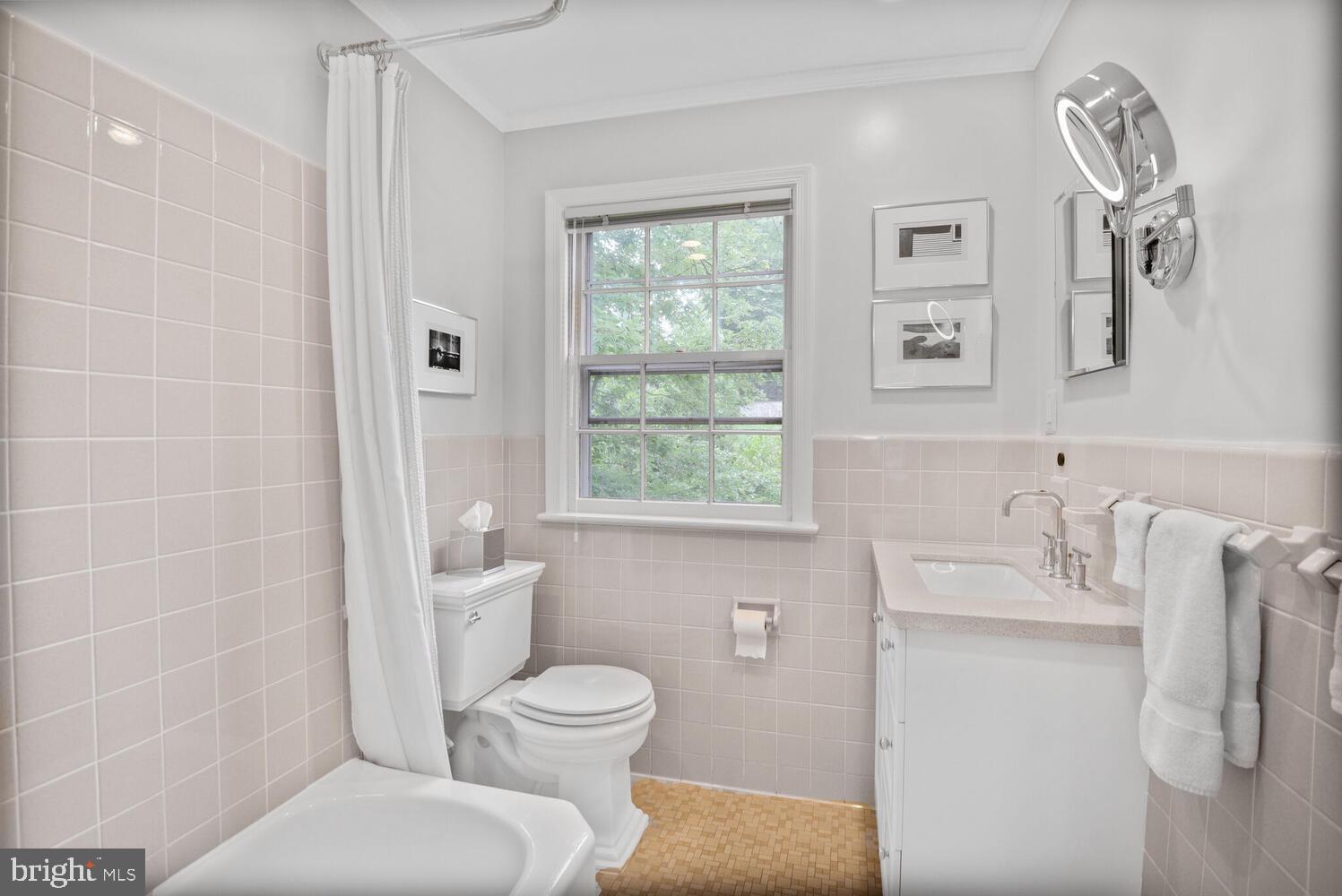 7721 Maryknoll Avenue Bethesda, MD 20817 - Photo 22 of 33 a bathroom with a toilet sink and shower