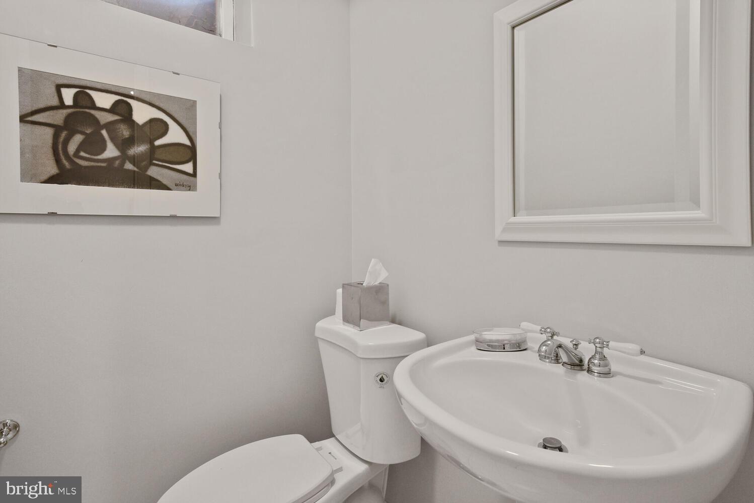7721 Maryknoll Avenue Bethesda, MD 20817 - Photo 27 of 33 a bathroom with a toilet and sink