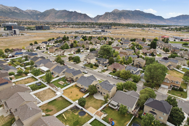 2223 North Pointe Meadow Loop Lehi, UT 84048 - Photo 53 of 56 Aerial view showcasing a residential neighborhood with detached homes, individual yards, and mature trees