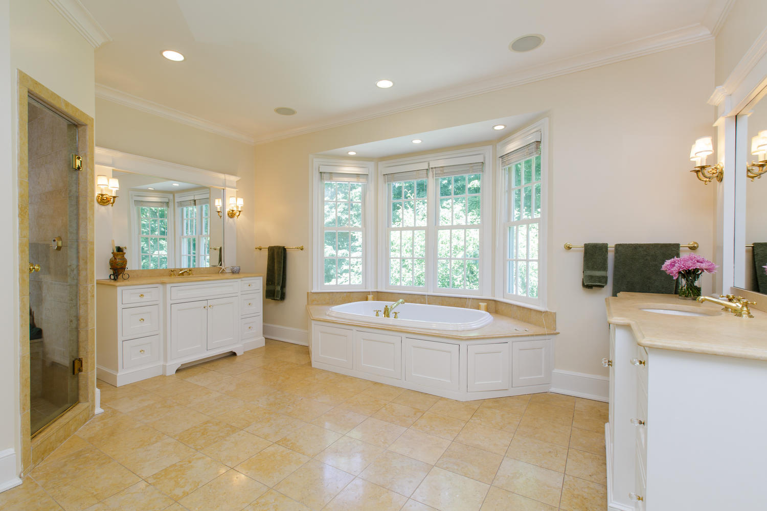 881 Valley Road New Canaan, CT 06840 - Photo 22 of 37 a spacious bathroom with a double vanity sink tub mirror and double