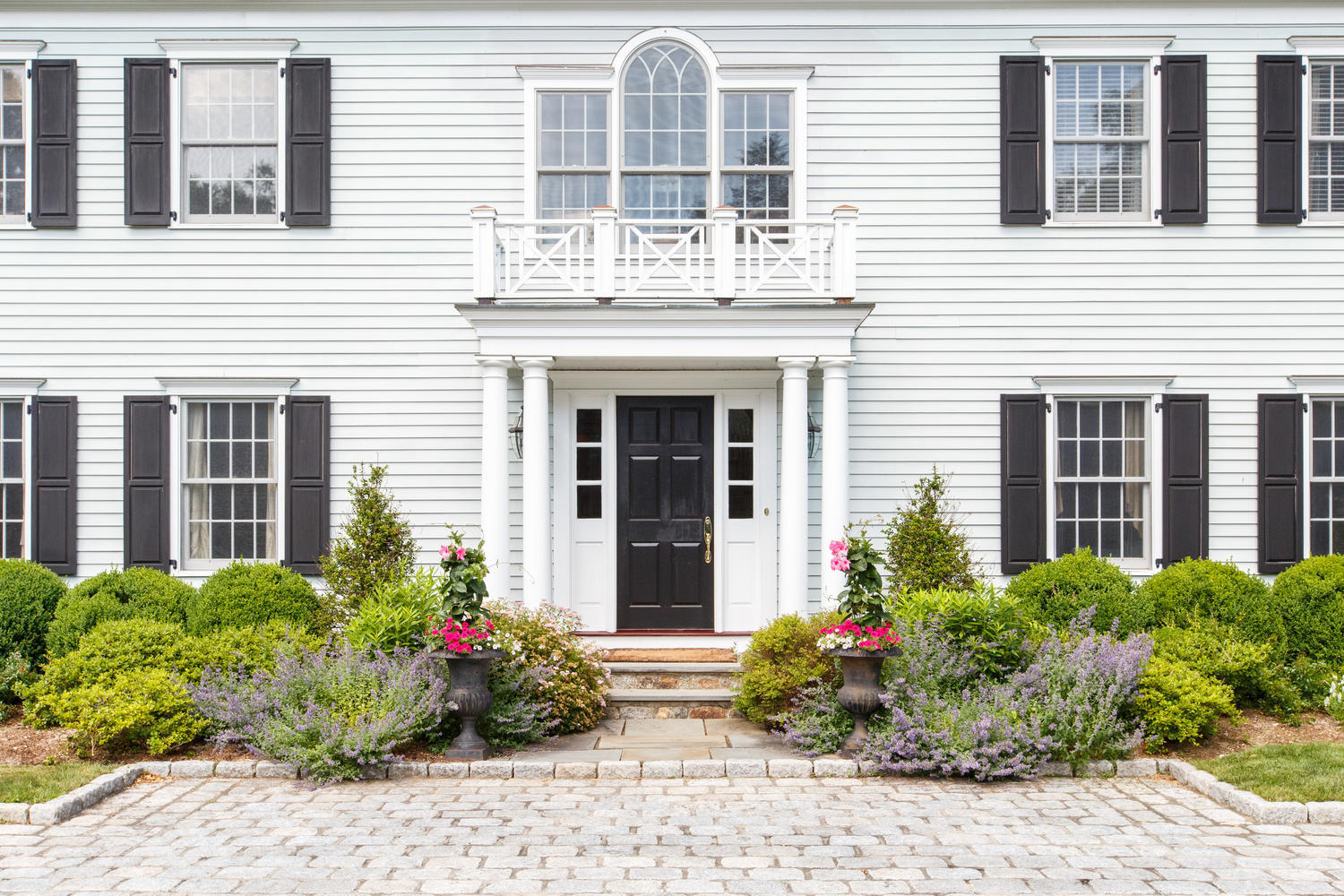 881 Valley Road New Canaan, CT 06840 - Photo 32 of 37 a view of a house with potted plants