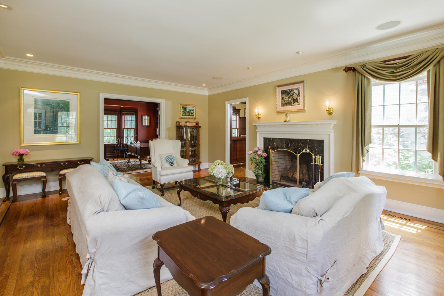 881 Valley Road New Canaan, CT 06840 - Photo 4 of 37 a living room with fireplace furniture and a fireplace