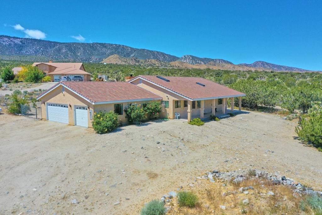 10198 Pineview Road Pinon Hills, CA 92372 - Photo 1 of 1 a view of a house with a yard and a lake view