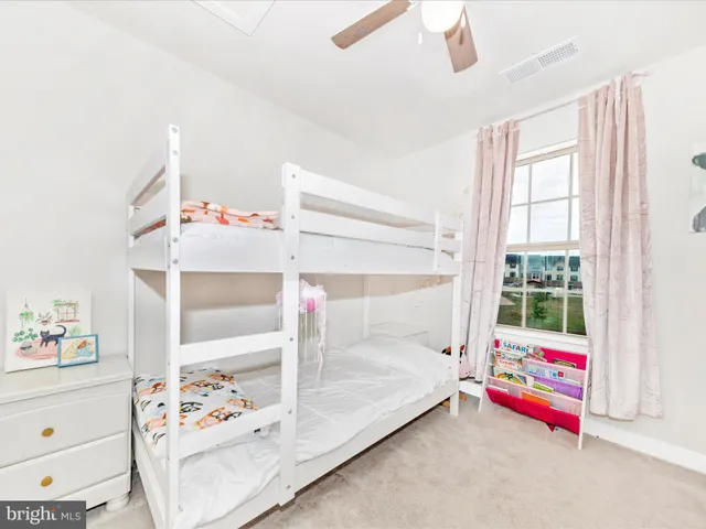 a view of a livingroom with wooden floor and entryway