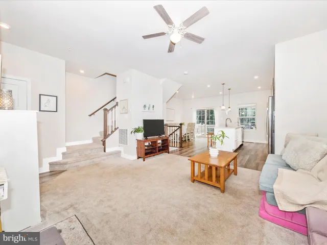 a living room with furniture and white walls