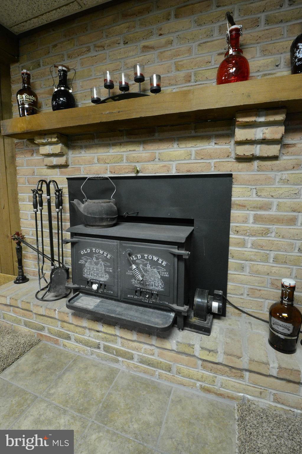 23 Troy Drive Lititz, PA 17543 - Photo 29 of 45 Nice Brick Fireplace with Wood Stove Insert!