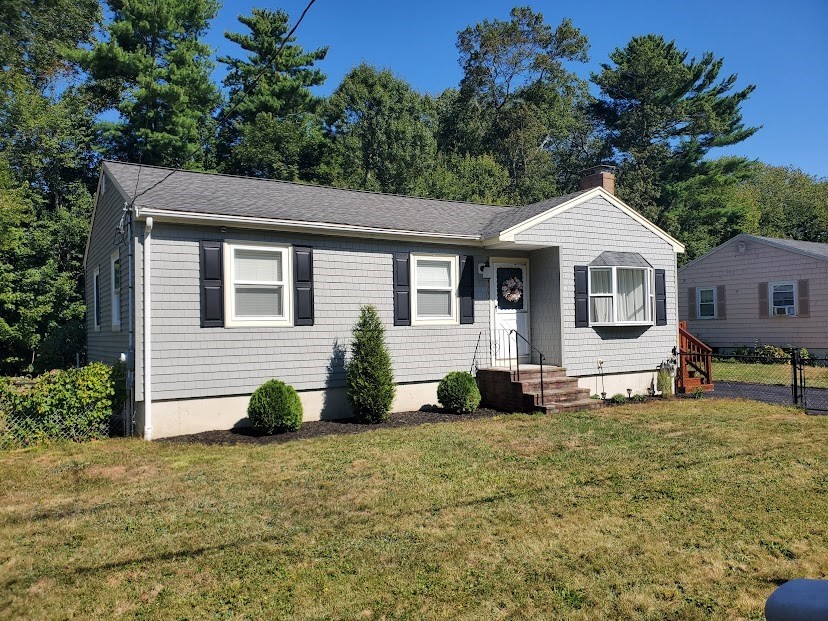 19 Calvin Road Easton, MA 02356 - Photo 2 of 14 a front view of a house with garden