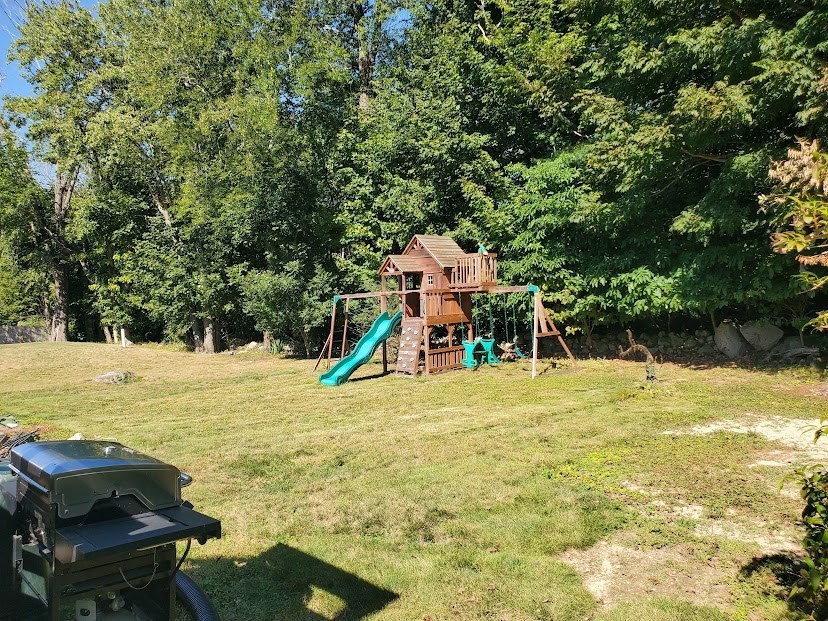 19 Calvin Road Easton, MA 02356 - Photo 3 of 14 a view of a swimming pool with a yard