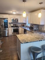 19 Calvin Road Easton, MA 02356 - Photo 4 of 14 a kitchen with stainless steel appliances granite countertop a sink a stove and a wooden floors