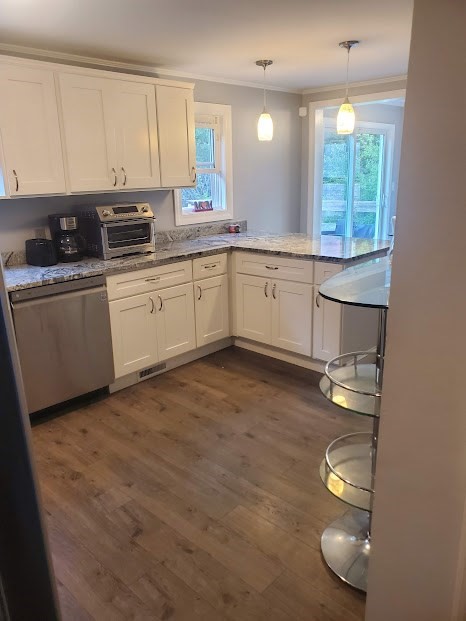 19 Calvin Road Easton, MA 02356 - Photo 6 of 14 a kitchen with a sink window and cabinets