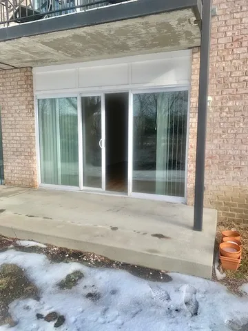 a view of a brick house with outdoor space