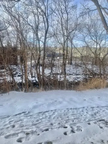a view of a yard covered with snow