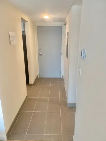 a bathroom with a glass door shower