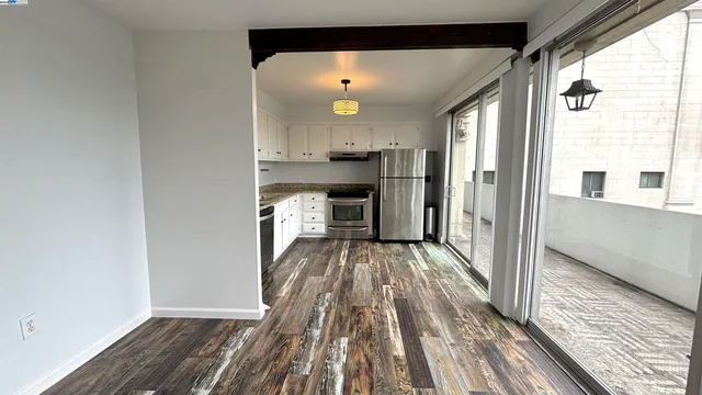 a view of a kitchen from the hallway