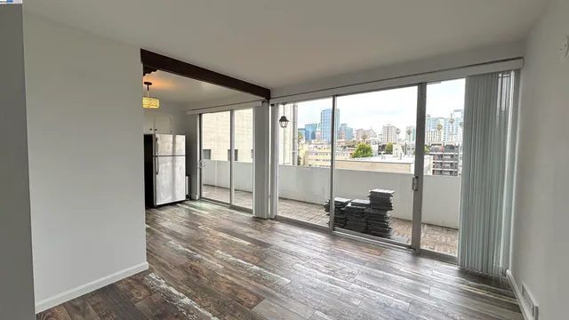 a view of workspace with furniture and floor to ceiling window