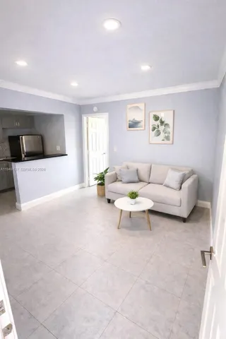 a living room with furniture and a couch