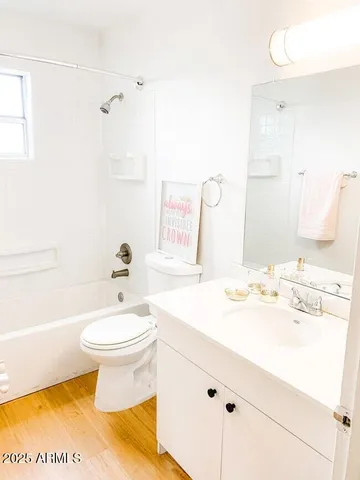 a bathroom with a sink toilet and a mirror