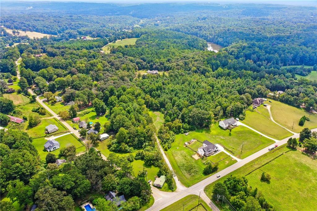 14430 Fincher Road Ball Ground, GA 30107 - Photo 11 of 51 an aerial view of a residential houses with a green space