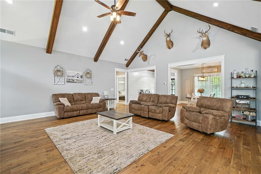 14430 Fincher Road Ball Ground, GA 30107 - Photo 21 of 51 a living room with furniture and wooden floor